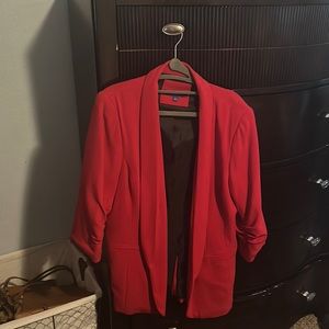 Jacket red and thigh length on me at 5’5”.  New and never worn.